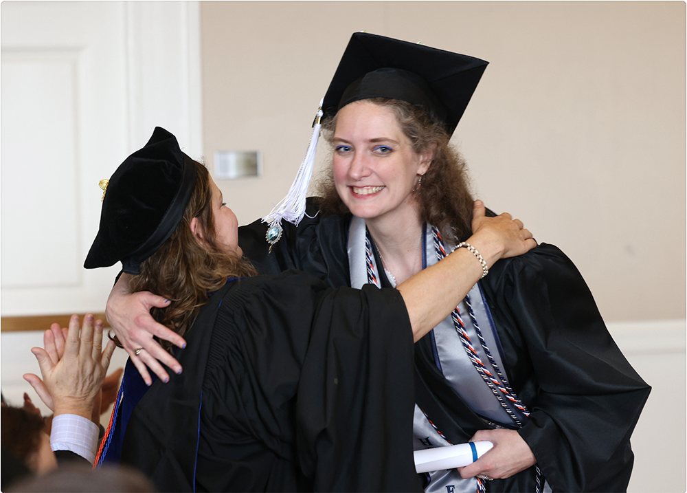 Piercy hugs a classmate at UVA Graduation